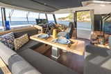 Dining table with helm and door to starboard side decks